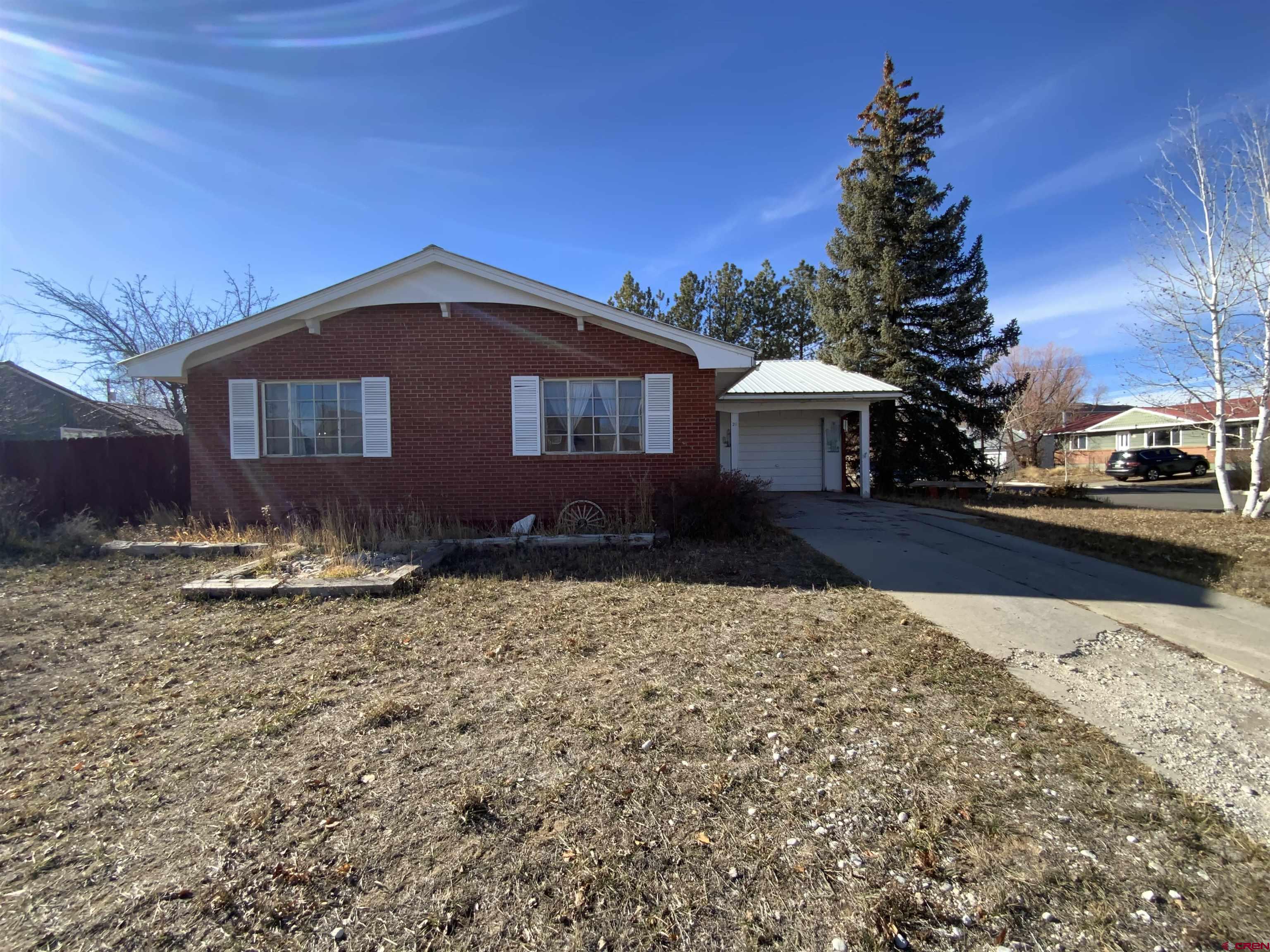 21 Vulcan Street Gunnison, CO 81230 - Photo 2 of 21 a front view of a house with a yard