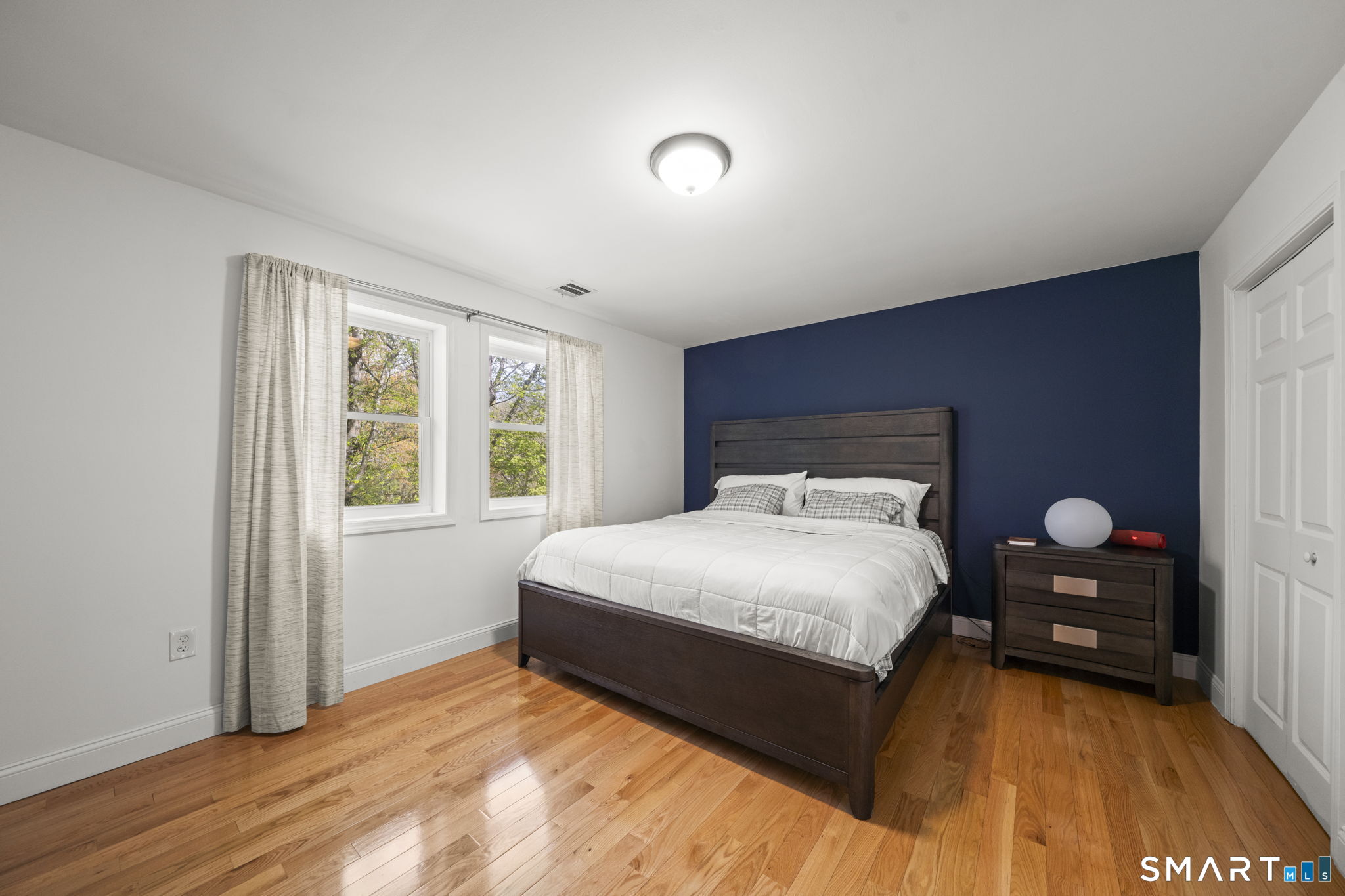 1118 Spindle Hill Road Wolcott, CT 06716 - Photo 20 of 38 a large bed sitting in a bedroom next to a window