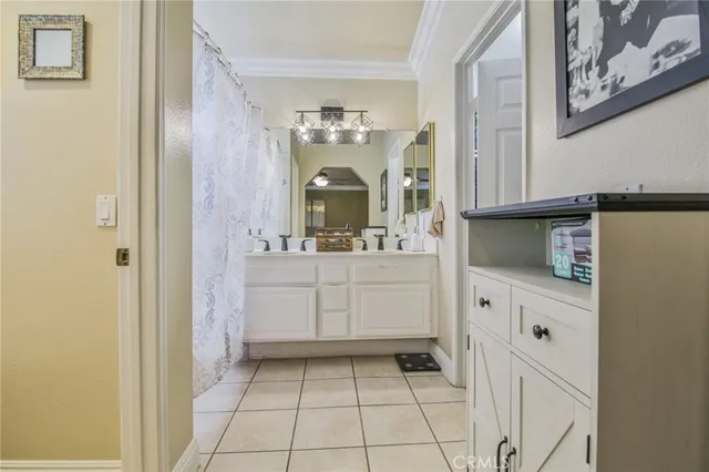a bathroom with a sink a mirror and a vanity