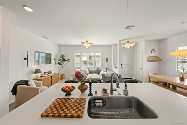 a spacious bathroom with a toilet sink and a mirror