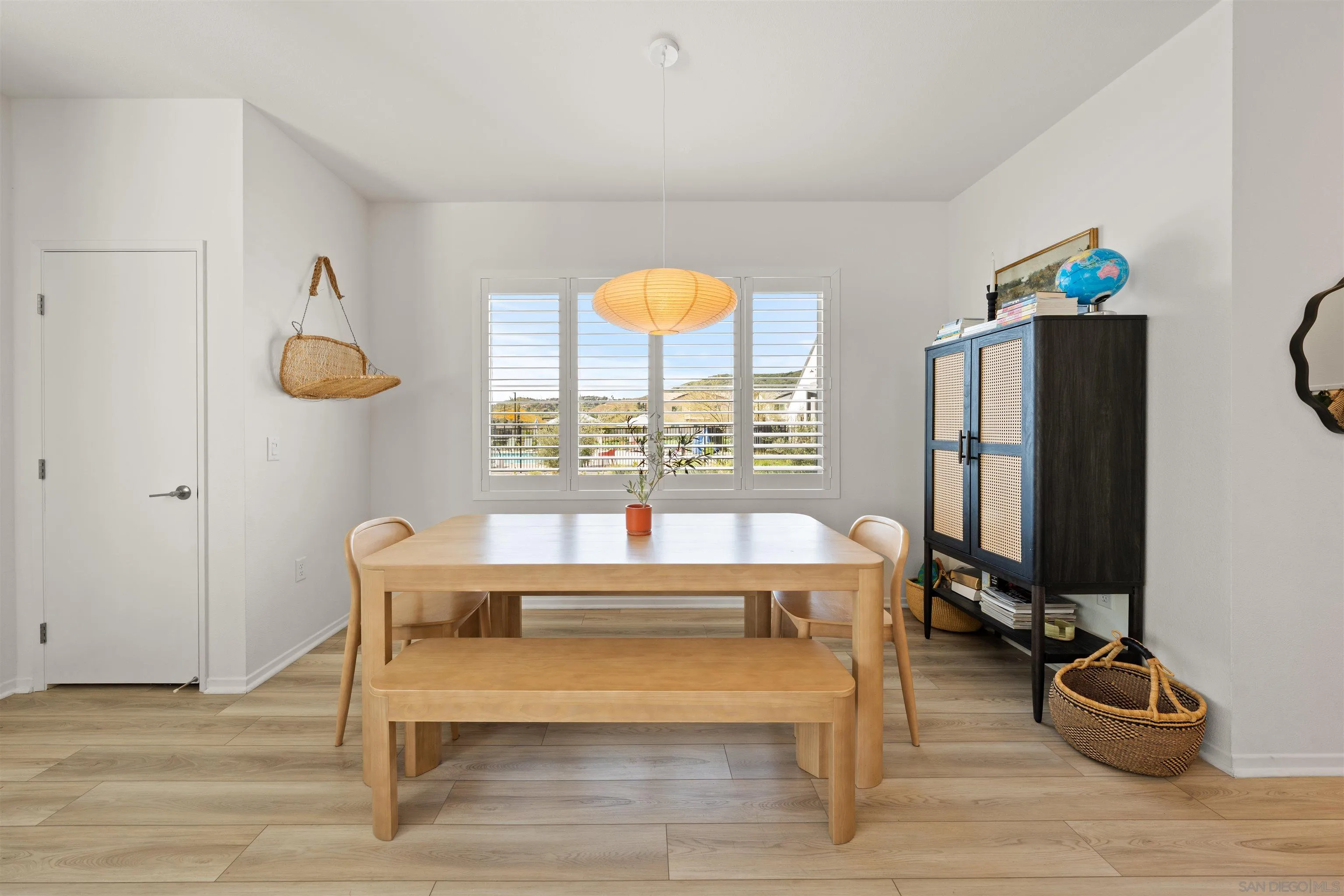 303 Citrine Trail Fallbrook, CA 92028 - Photo 14 of 47 a room with a table and a flat screen tv