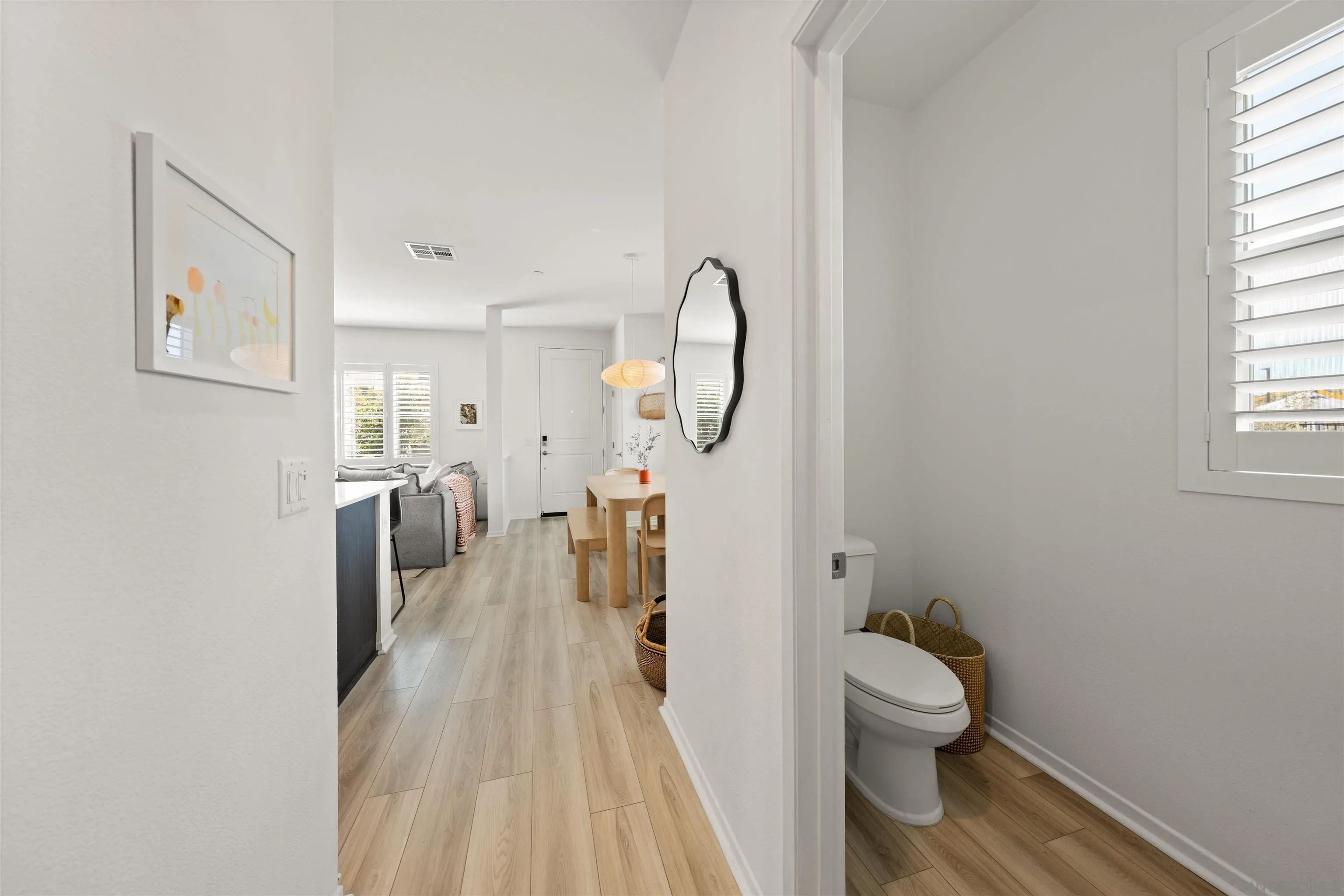 303 Citrine Trail Fallbrook, CA 92028 - Photo 18 of 47 a spacious bathroom with a toilet sink and a mirror