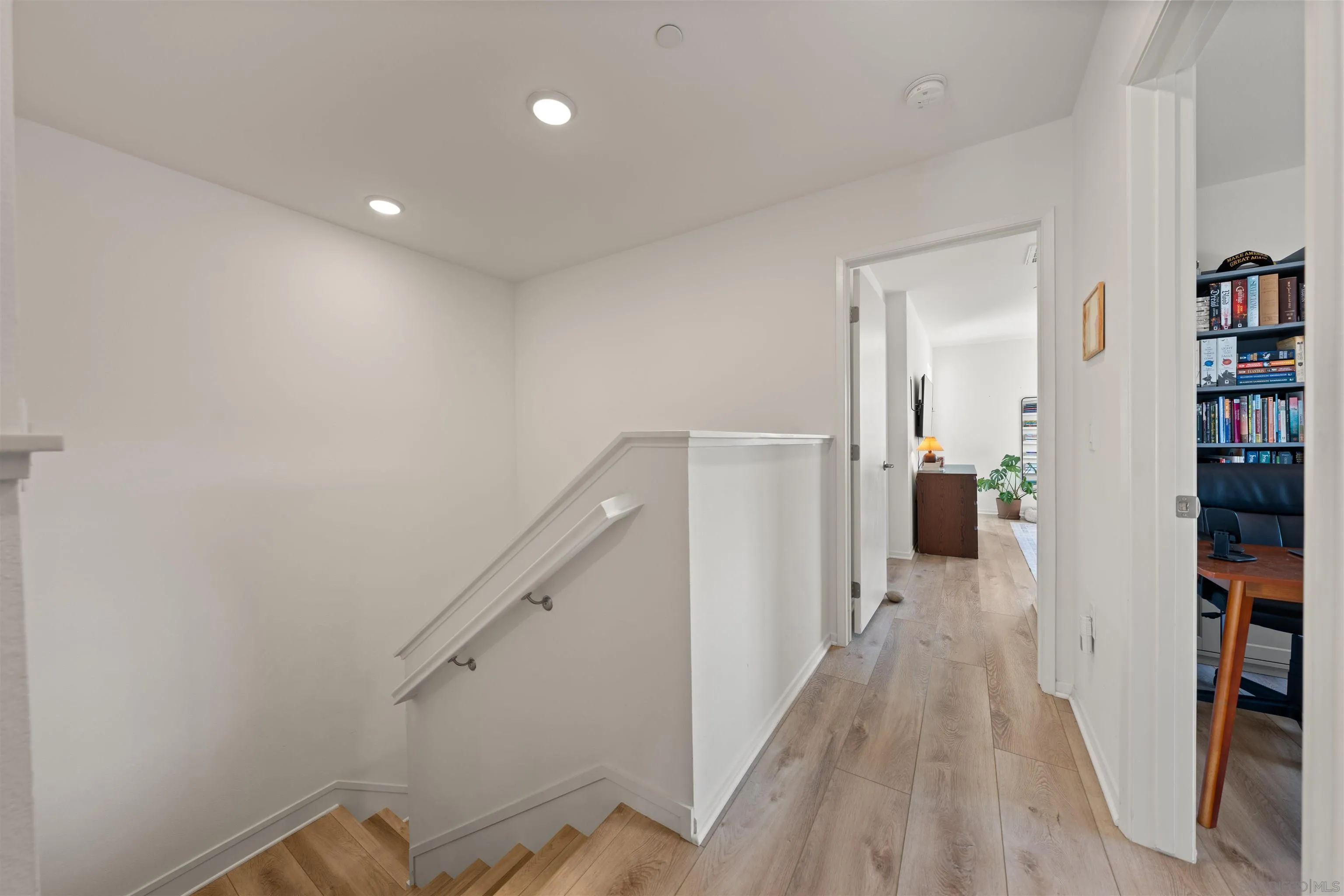 303 Citrine Trail Fallbrook, CA 92028 - Photo 20 of 47 a view of a hallway with wooden floor and staircase