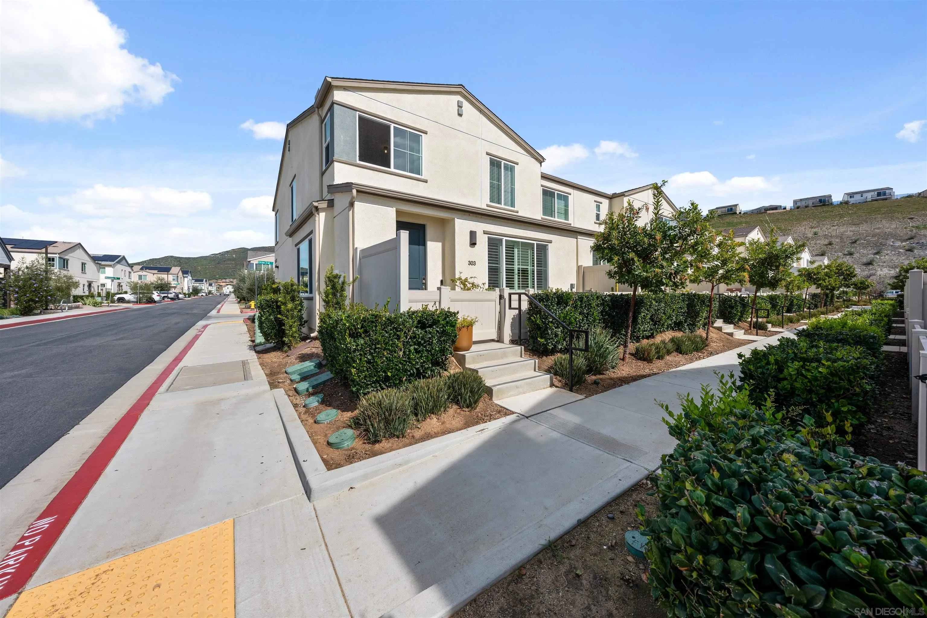 303 Citrine Trail Fallbrook, CA 92028 - Photo 5 of 47 a front view of a house with yard and green space