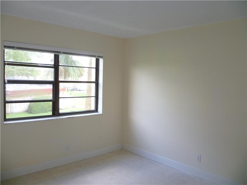 9233 Southwest 8th Street, Unit 222 Boca Raton, FL 33428 - Photo 7 of 16 Guest bedroom