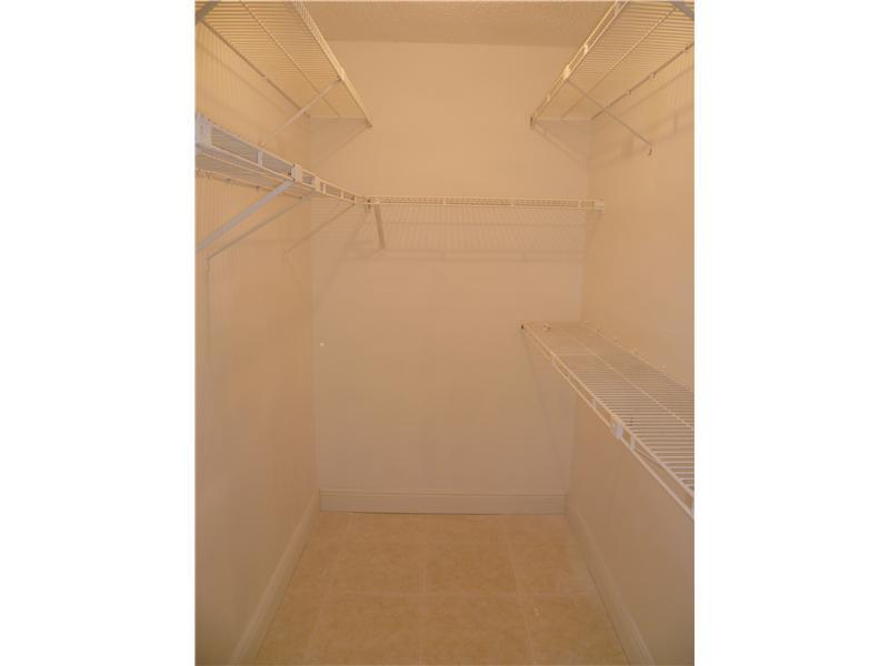 9233 Southwest 8th Street, Unit 222 Boca Raton, FL 33428 - Photo 8 of 16 Master walk in closet