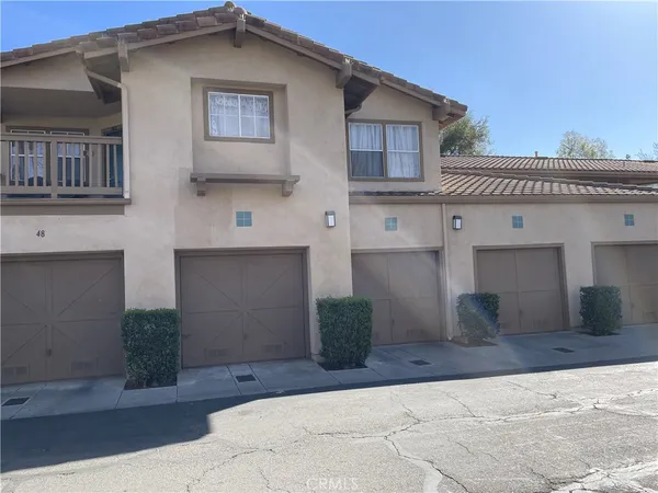 a front view of a house with garage