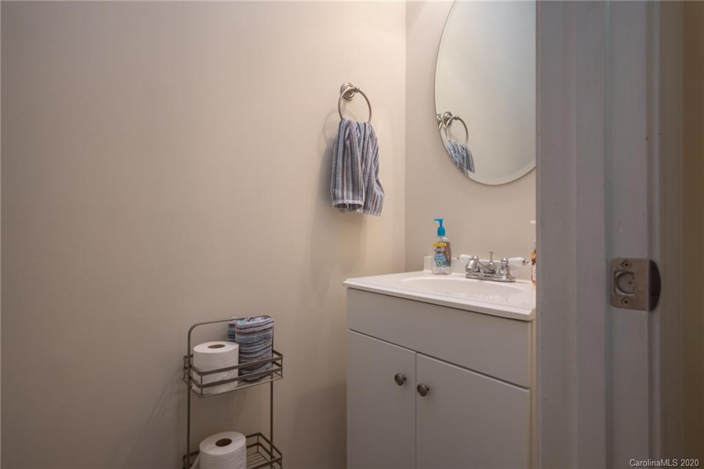 3143 Tanzanite Circle Fort Mill, SC 29708 - Photo 12 of 33 a bathroom with a sink a light fixture and a mirror