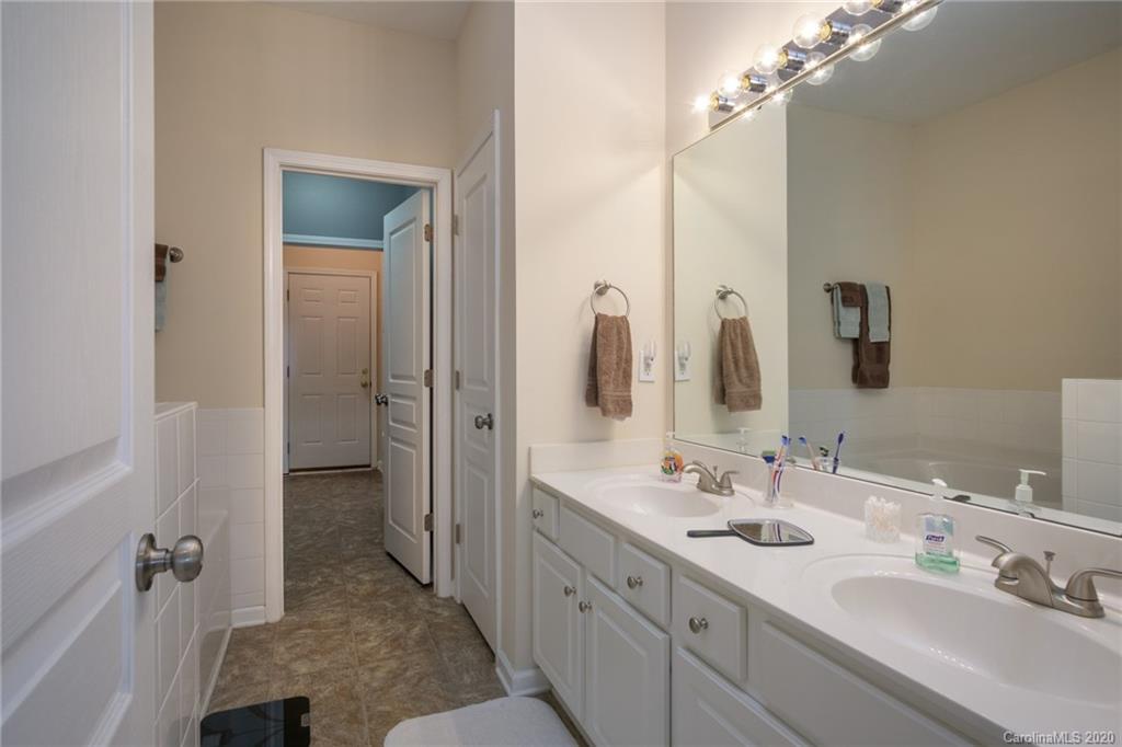 3143 Tanzanite Circle Fort Mill, SC 29708 - Photo 16 of 33 a bathroom with a double vanity sink and mirror