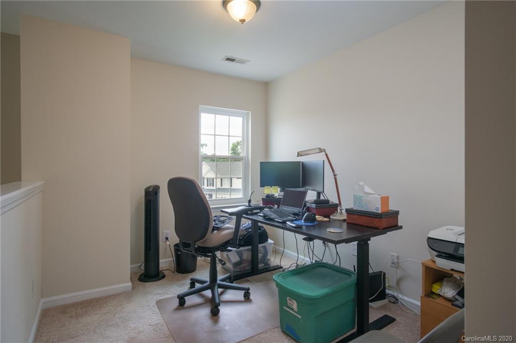3143 Tanzanite Circle Fort Mill, SC 29708 - Photo 19 of 33 a view of a workspace with furniture and a window