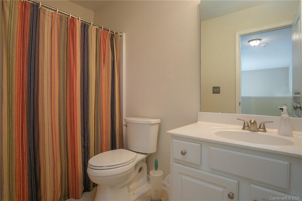 3143 Tanzanite Circle Fort Mill, SC 29708 - Photo 20 of 33 a bathroom with a sink a toilet and shower curtain