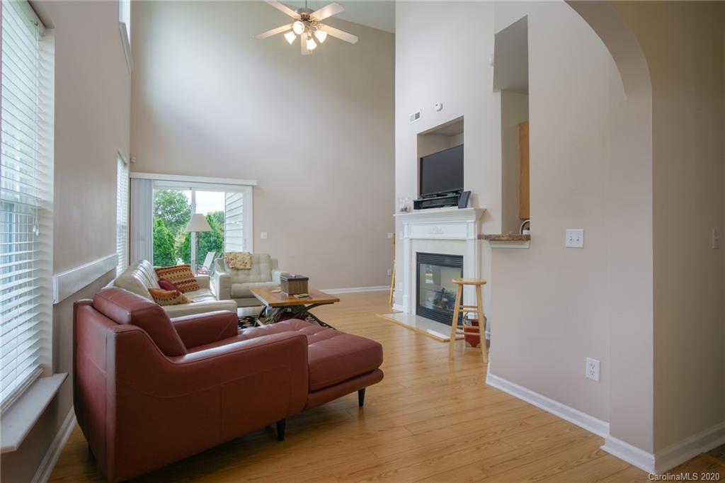 3143 Tanzanite Circle Fort Mill, SC 29708 - Photo 4 of 33 a living room with furniture and a fireplace