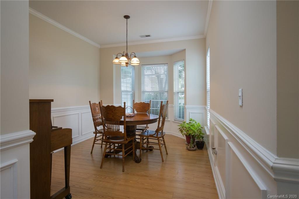3143 Tanzanite Circle Fort Mill, SC 29708 - Photo 6 of 33 a view of a dining room with furniture window and wooden floor