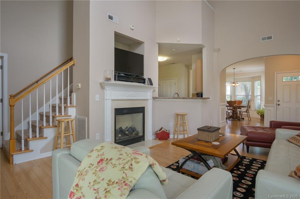 3143 Tanzanite Circle Fort Mill, SC 29708 - Photo 8 of 33 a living room with a fireplace and a flat screen tv