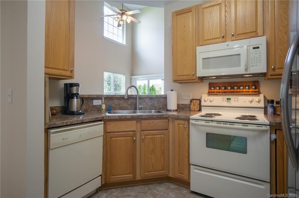 3143 Tanzanite Circle Fort Mill, SC 29708 - Photo 9 of 33 a kitchen with stainless steel appliances granite countertop a stove and a microwave