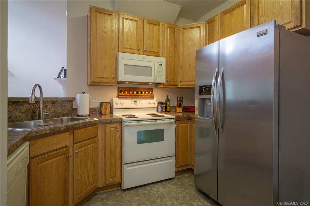 3143 Tanzanite Circle Fort Mill, SC 29708 - Photo 10 of 33 a kitchen with stainless steel appliances a refrigerator sink and cabinets