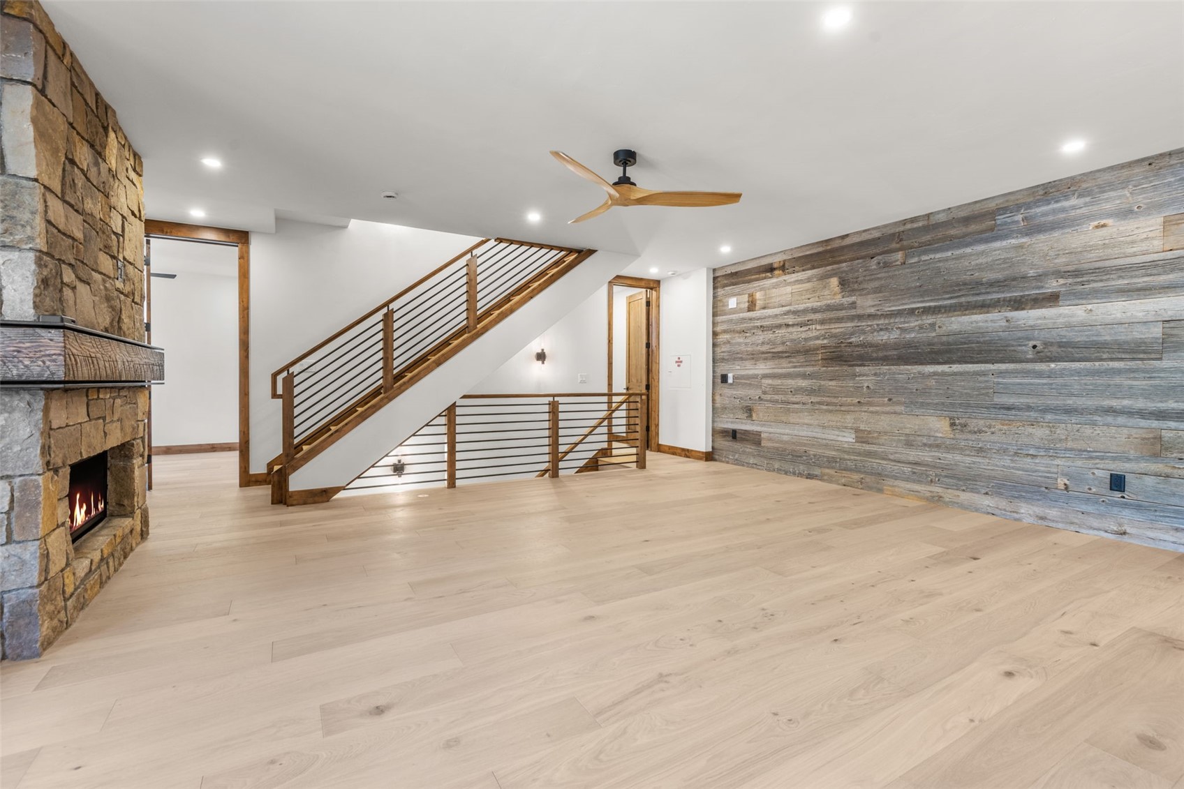 308 3rd Avenue Frisco, CO 80443 - Photo 12 of 45 wooden floor in an empty room with a fireplace