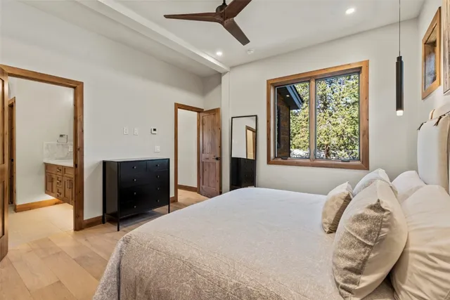 a bedroom with a bed and a television