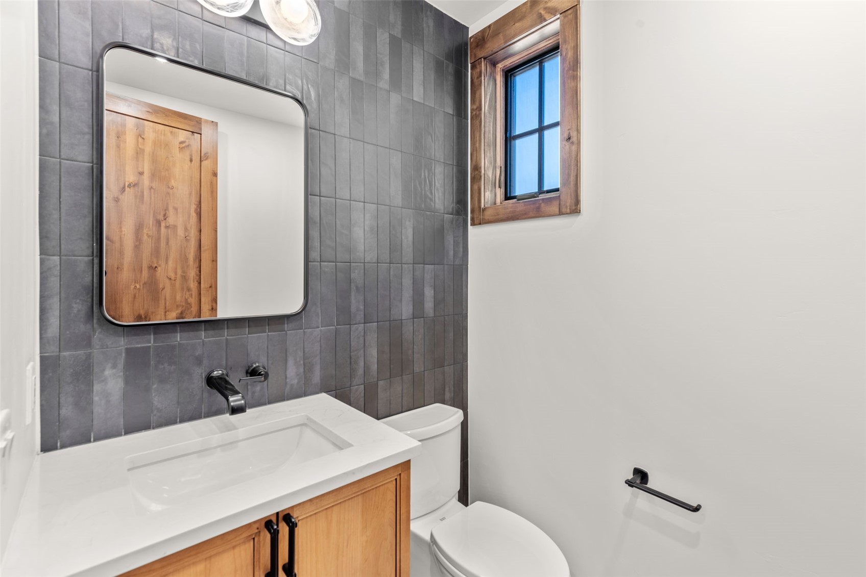 308 3rd Avenue Frisco, CO 80443 - Photo 16 of 45 a bathroom with a sink vanity mirror and toilet