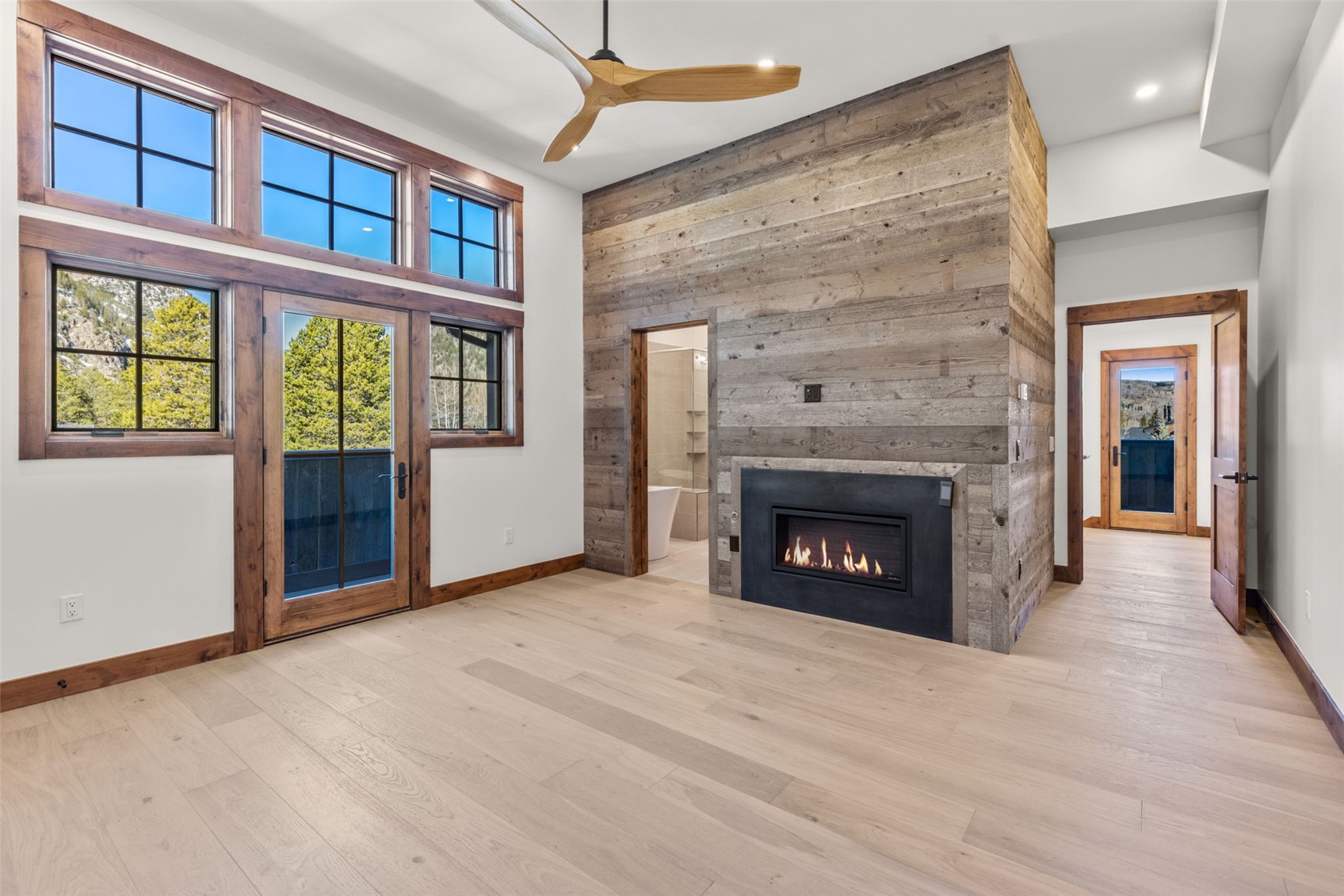 308 3rd Avenue Frisco, CO 80443 - Photo 18 of 45 a view of an empty room with a fireplace and a window