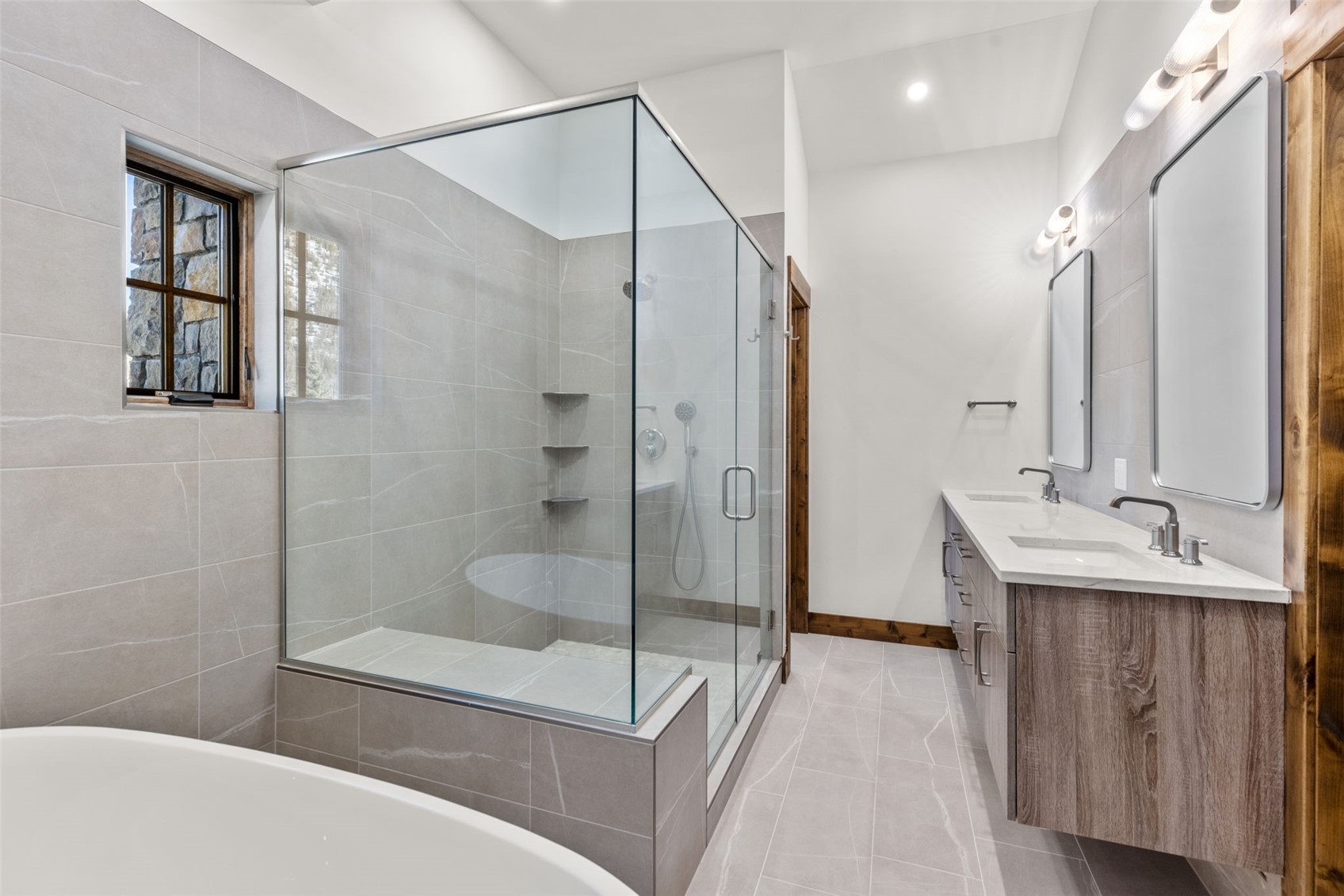 308 3rd Avenue Frisco, CO 80443 - Photo 20 of 45 a bathroom with a bathtub shower sink and mirror