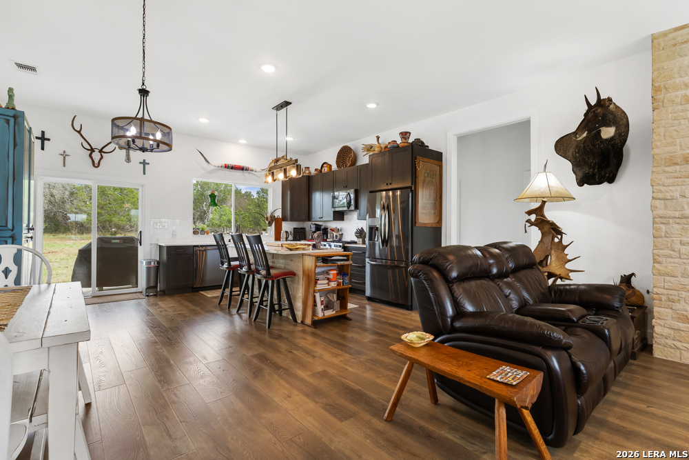 175 Pine Tree Road Medina, TX 78055 - Photo 11 of 34 a living room with furniture and wooden floor