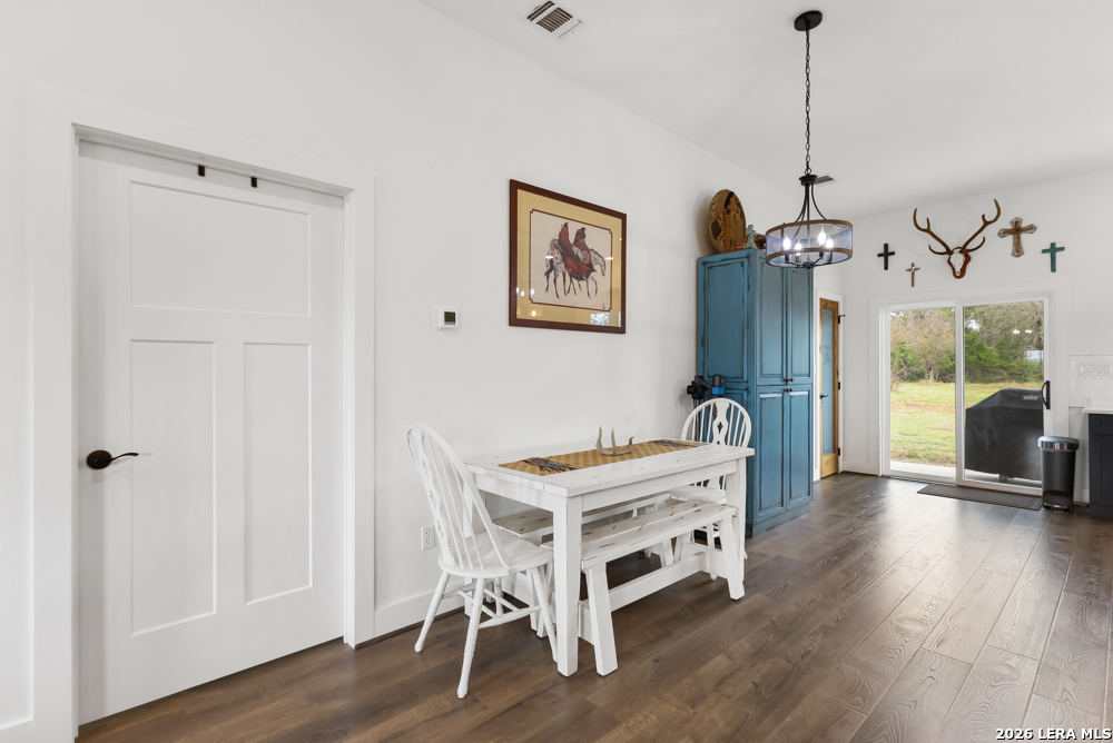 175 Pine Tree Road Medina, TX 78055 - Photo 14 of 34 a room with furniture and a wooden floor