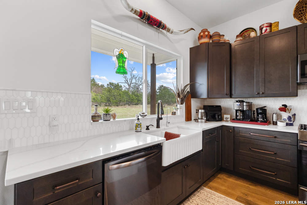 175 Pine Tree Road Medina, TX 78055 - Photo 17 of 34 a kitchen with cabinets and appliances