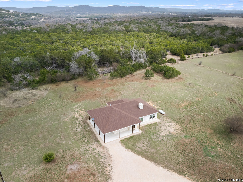 175 Pine Tree Road Medina, TX 78055 - Photo 2 of 34 an aerial view of a house with a yard