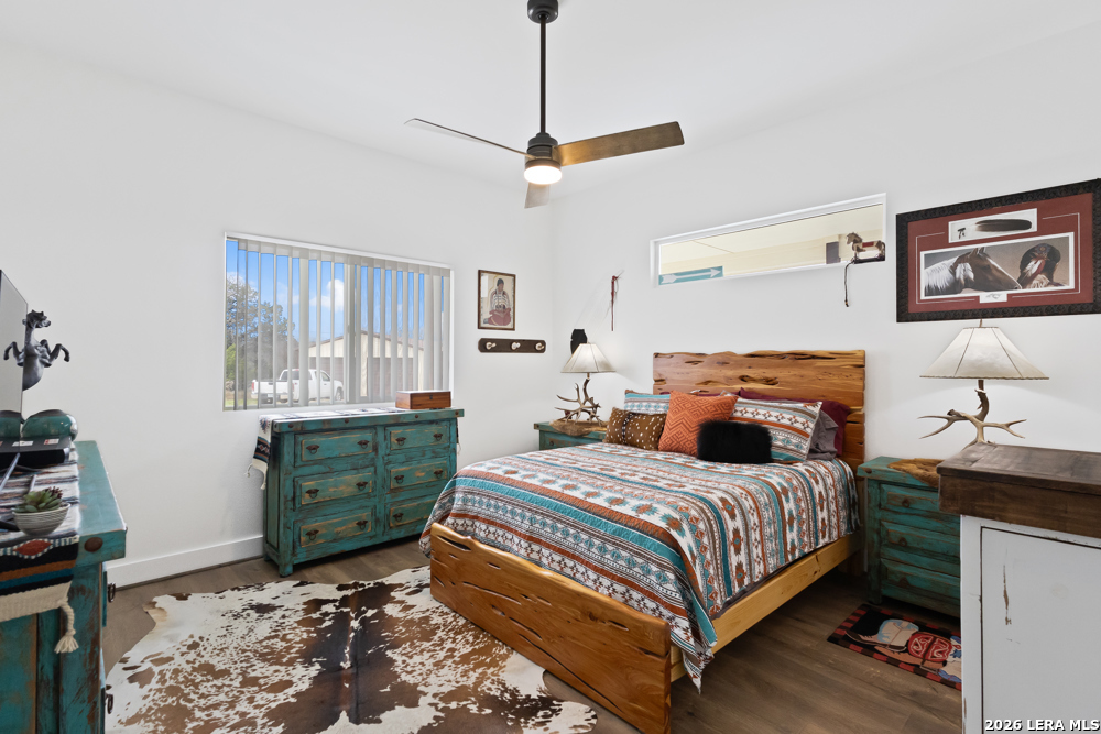 175 Pine Tree Road Medina, TX 78055 - Photo 22 of 34 a bedroom with a bed and a window