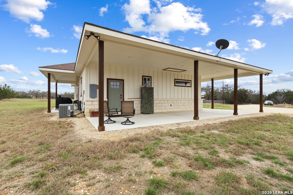 175 Pine Tree Road Medina, TX 78055 - Photo 6 of 34 a view of a house with backyard and porch