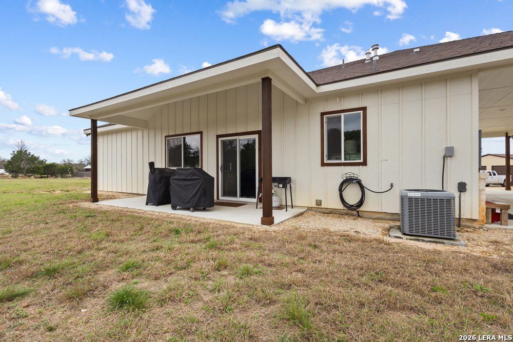175 Pine Tree Road Medina, TX 78055 - Photo 7 of 34 a view of a house with backyard and a tree