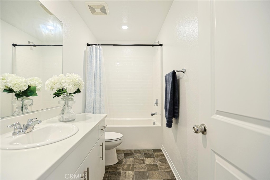 7486 Olive Grv Street Riverside, CA 92507 - Photo 31 of 57 a bathroom with a sink toilet and shower