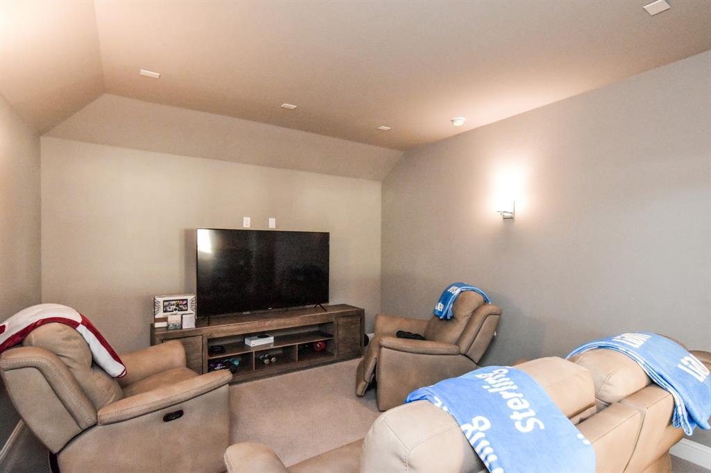 2516 Maidenhair Road Frisco, TX 75033 - Photo 18 of 30 a living room with furniture and a flat screen tv