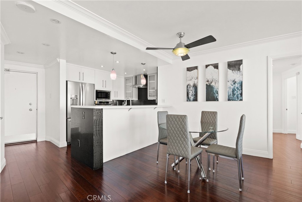 700 East Ocean Boulevard, Unit 1104 Long Beach, CA 90802 - Photo 14 of 47 a view of a dining room with furniture and wooden floor
