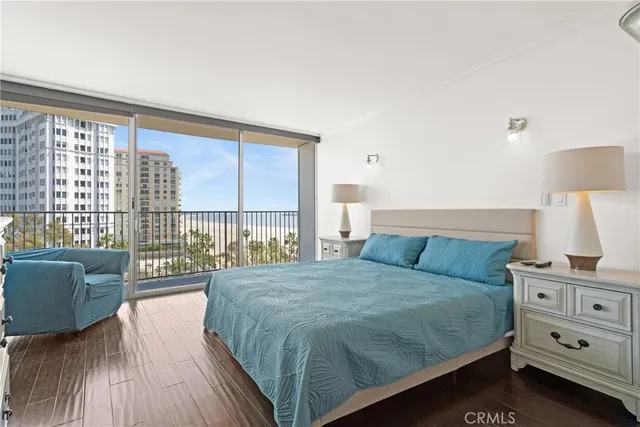 a bedroom with a bed and a night stand