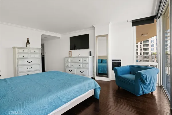 a bedroom with a bed and a couch