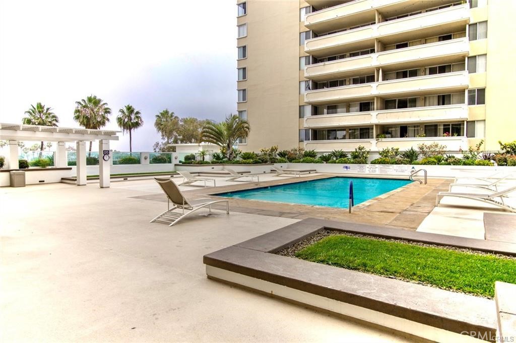 700 East Ocean Boulevard, Unit 1104 Long Beach, CA 90802 - Photo 35 of 47 a view of a swimming pool with a lounge chairs