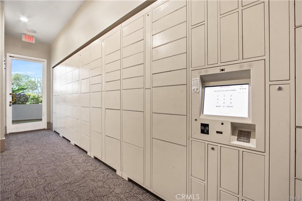 700 East Ocean Boulevard, Unit 1104 Long Beach, CA 90802 - Photo 39 of 47 a view of a refrigerator in kitchen and white cabinets