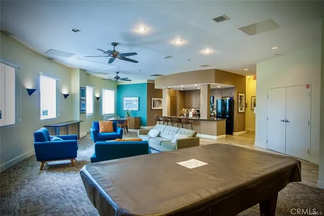 a living room with dining table and a couch