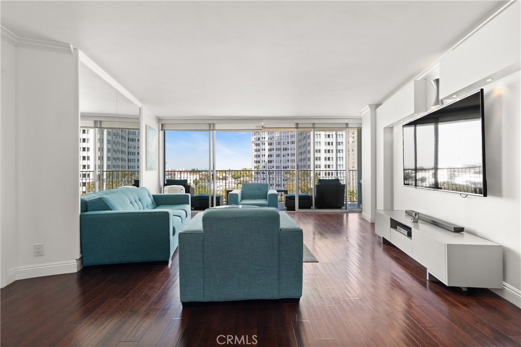 700 East Ocean Boulevard, Unit 1104 Long Beach, CA 90802 - Photo 9 of 47 a living room with furniture and a large window