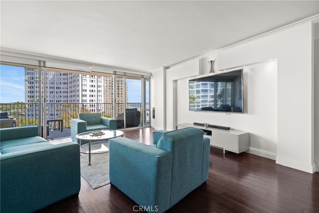 700 East Ocean Boulevard, Unit 1104 Long Beach, CA 90802 - Photo 10 of 47 a living room with furniture and wooden floor