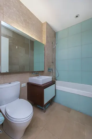 a kitchen with stainless steel appliances granite countertop a sink and a stove top oven