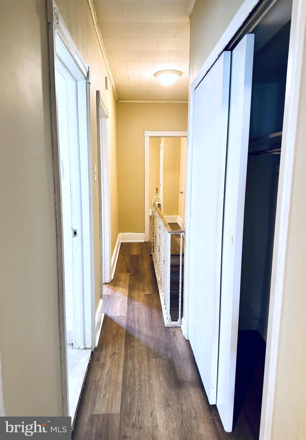 2246 South Bucknell Street Philadelphia, PA 19145 - Photo 11 of 25 a view of a hallway with wooden floor and staircase