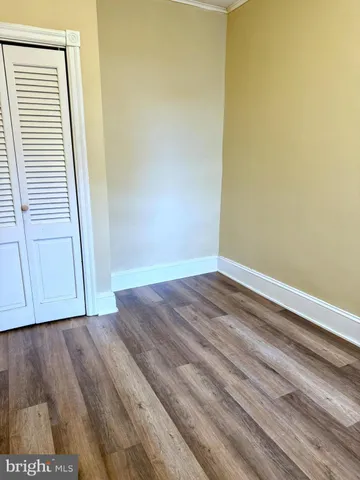 a view of a small space with wooden floor