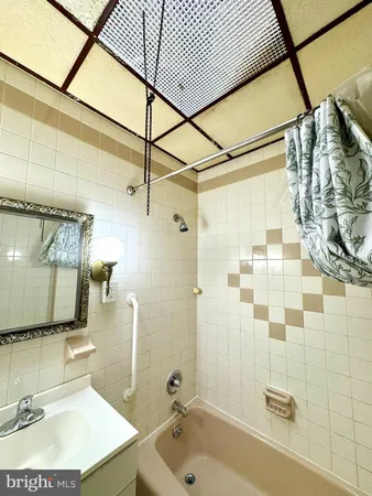 a bathroom with a sink and shower