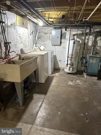 a storage room with water heater and racks