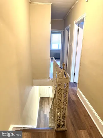 a view of an entryway with wooden floor