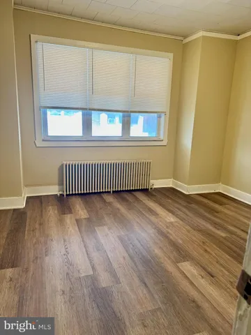 a view of a livingroom with wooden floor