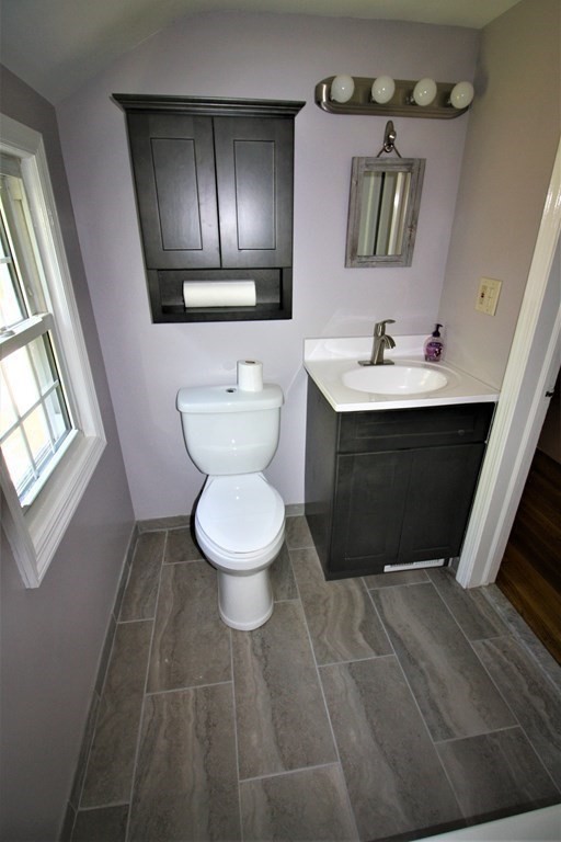 116 Donbray Road Springfield, MA 01119 - Photo 14 of 42 a bathroom with a toilet sink and mirror